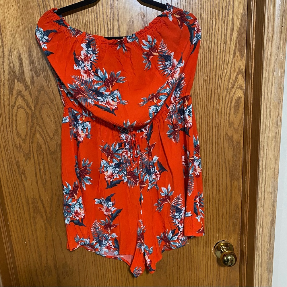 Orange floral romper with stretchy waist and tie